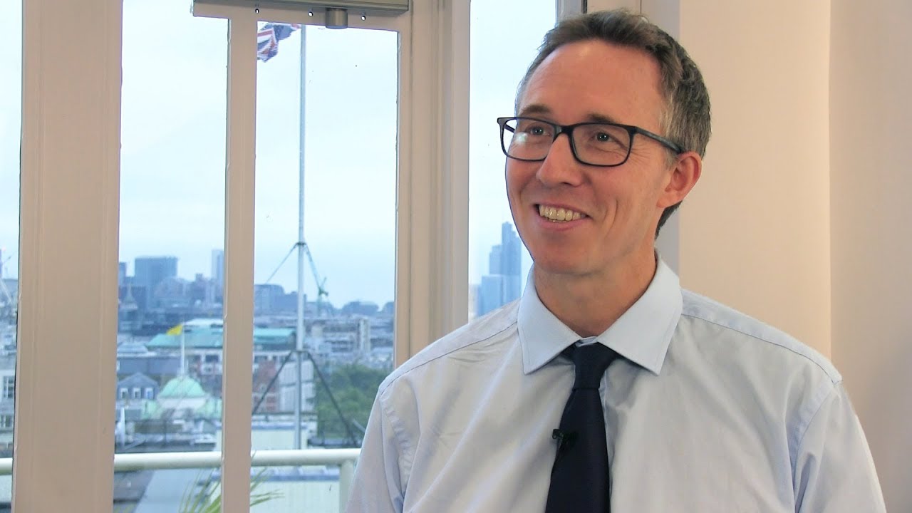 Why did CFA UK choose to run their high-stakes exam through computer-based testing?